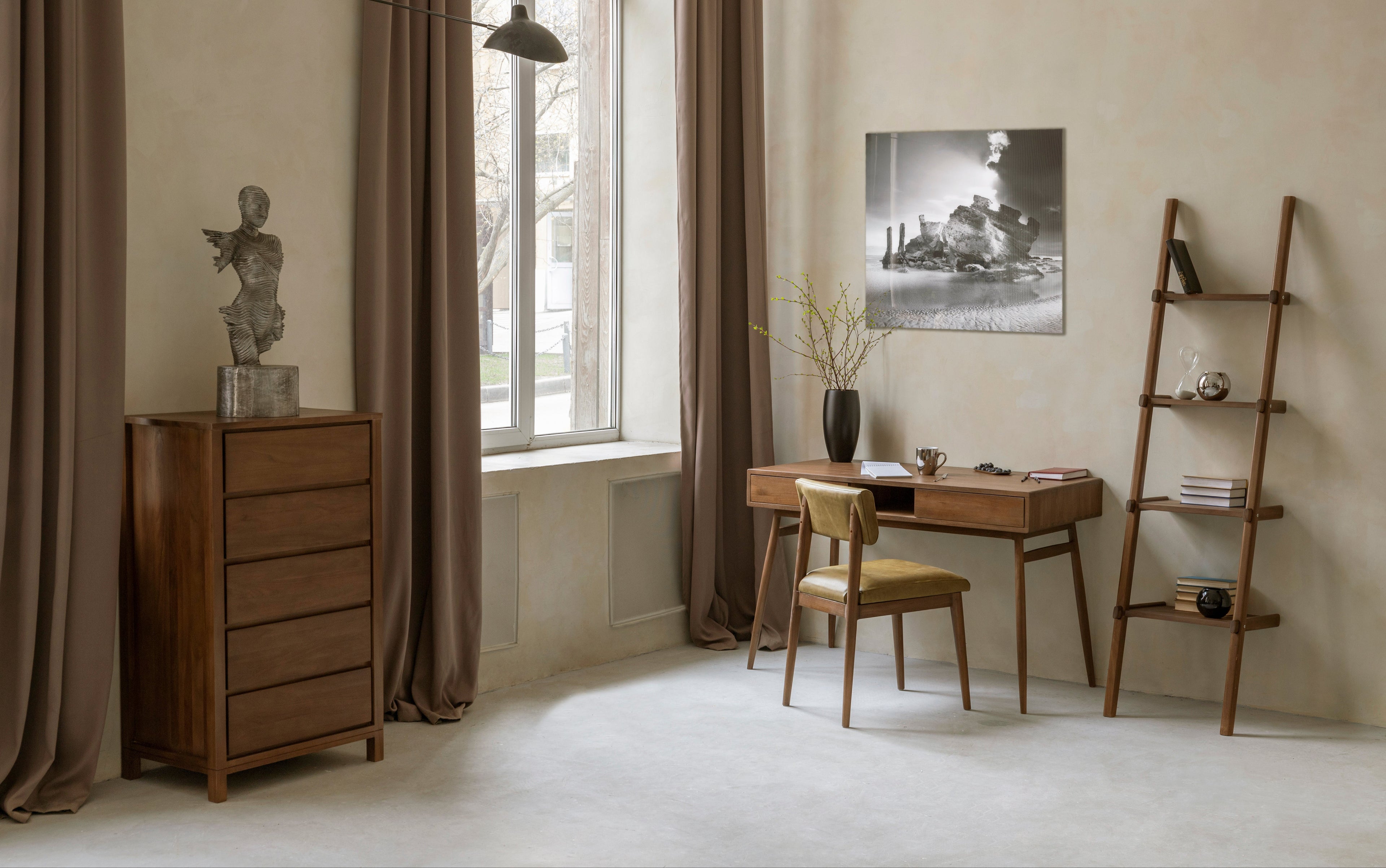 Neatly arranged room with wooden furniture including a desk, chair, and shelves.